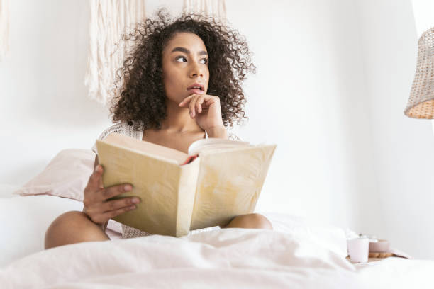 istock Serious young female person looking aside at window 1179011039