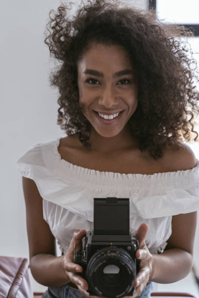 istock Cheerful photographer preparing for her working day 1179011081