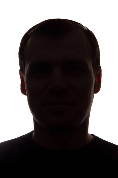 istock Portrait of a young man, front view - dark isolated silhouette 1179013519