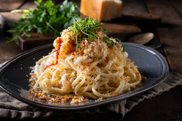 Vegetarian Spaghetti Spaghetti with Parmesan Cheese, Roasted Cauliflower and Breadcrumbs. italian food stock pictures, royalty-free photos & images
