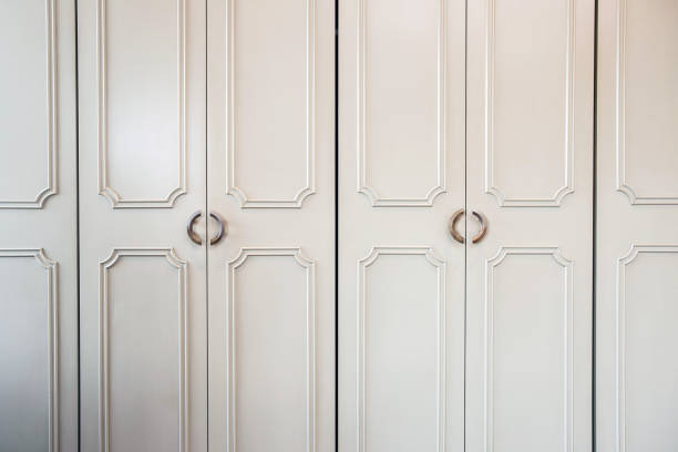 istock White luxury closet doors wood closeup, modern design 1179017541