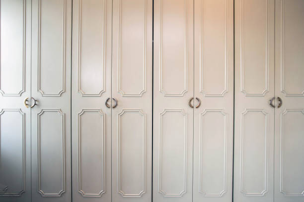 istock White luxury closet doors wood closeup, modern design 1179017553