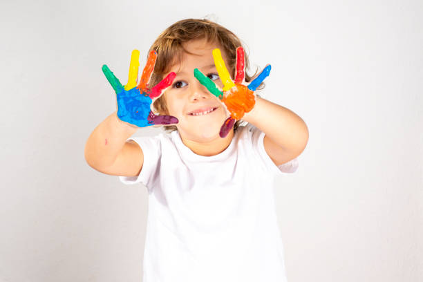istock Boy Showing Colorful Paint on His Hands 1179020372