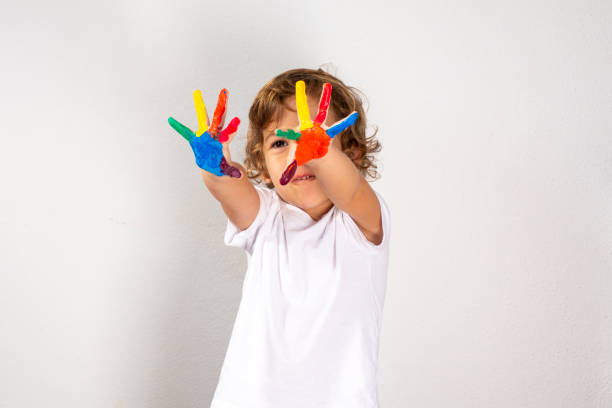 istock Boy Showing Colorful Paint on His Hands 1179020662