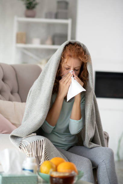 istock Woman covered in plaid having running nose 1179020795
