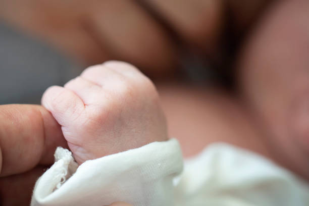 istock Baby Holding Mothers Hand 1179022092
