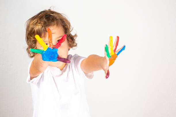 Boy Showing Colorful Paint on His Hands