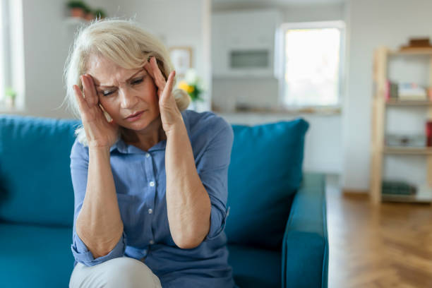 istock Senior Woman with Headache 1179022324