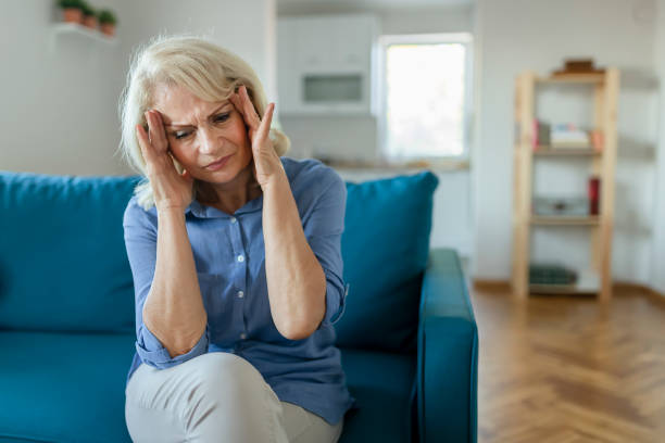 istock Senior Woman with Headache 1179022421