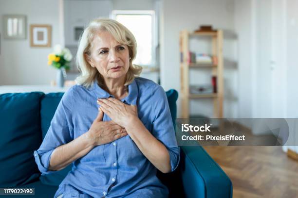 Upset Stressed Older Woman Feeling Heartache Stock Photo - Download Image Now - Heart - Internal Organ, Women, Pain