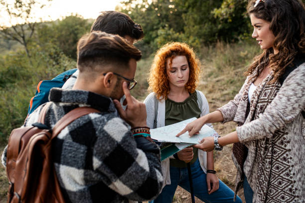 istock Friends looking at map on hiking 1179023527