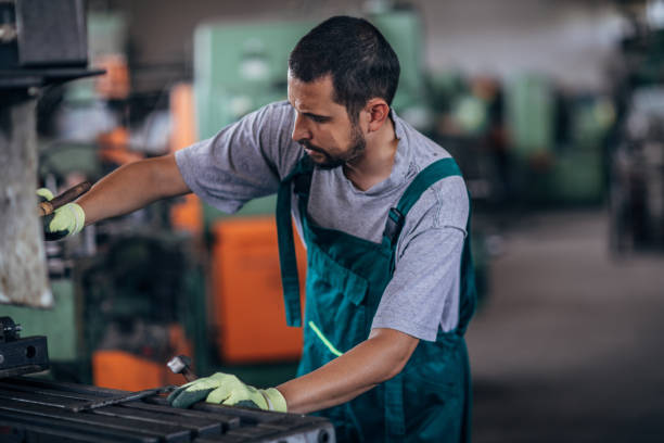 istock Young man working in metal factory 1179023826