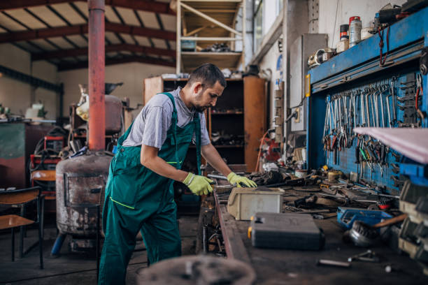 istock Young man working in metal factory 1179023862