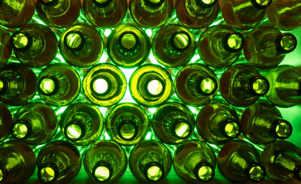 istock glass beer bottles lie in rows, necks on camera, shallow depth of sharp 1179023886