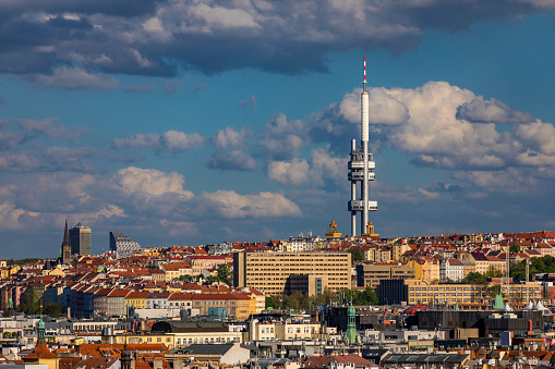 Panoramic view of Prague with red roofs and Zizkov television tower in the background, Prague, Czech republic. Prague landscape on a sunny day with the famous Zizkov TV tower on the horizon. Czechia.
