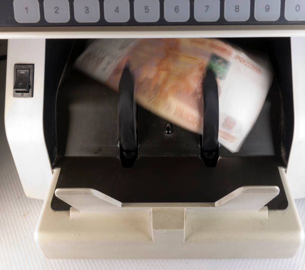 istock electronic money counter machine is counting the Russian five-thousandth ruble banknotes,blurry, effect of the movement 1179025139