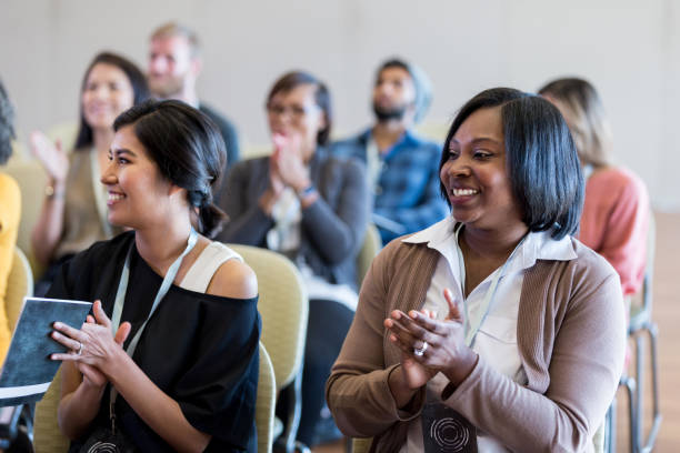 istock Diverse audience applauds unseen event speaker after talk 1179025380