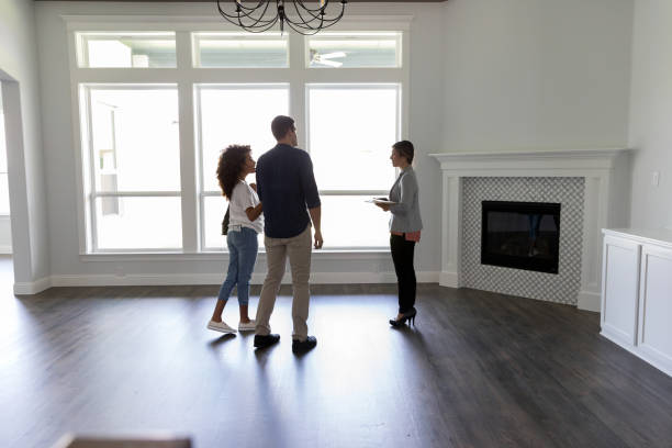 istock Real estate agent showing home 1179026116