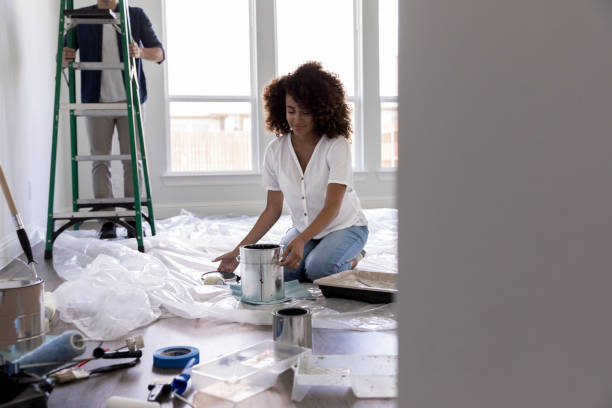 istock Young woman working on DIY project 1179026159