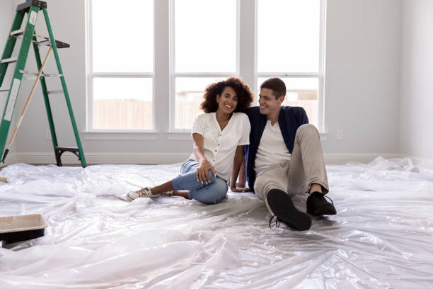 istock Couple enjoy relaxing in new home 1179026164