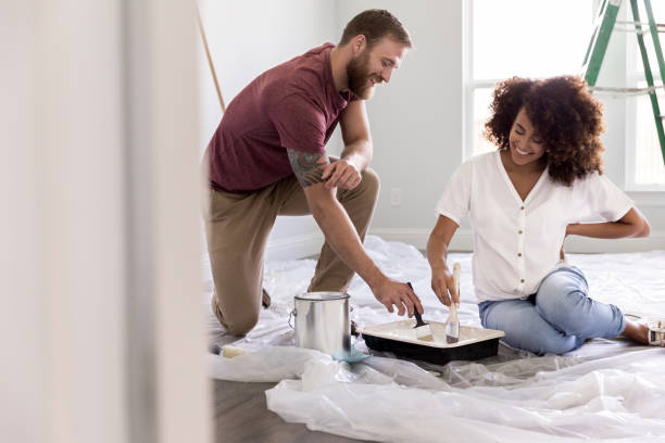 istock Couple paint room together 1179026171