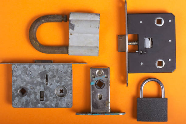 istock Various door locks on an orange background close-up. 1179027692