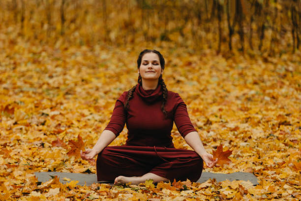 istock Plus size girl doing yoga in nature. 1179033197
