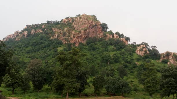 Bared rocky hill in rainy season.