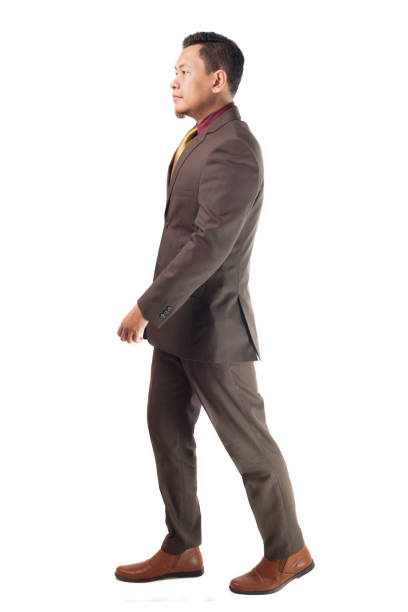 Young Asia Businessman Walking, Side View
