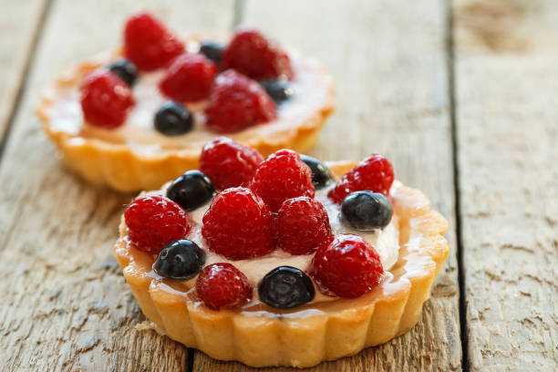 istock Cup of coffee and sweet cakes with berries 1179046582