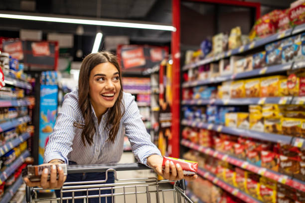 istock Happy woman at supermarket 1179047070