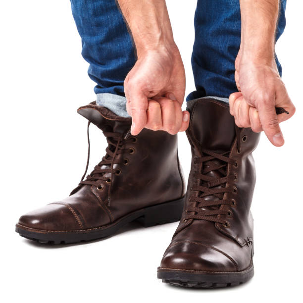 istock Man lacing shoes 1179047153