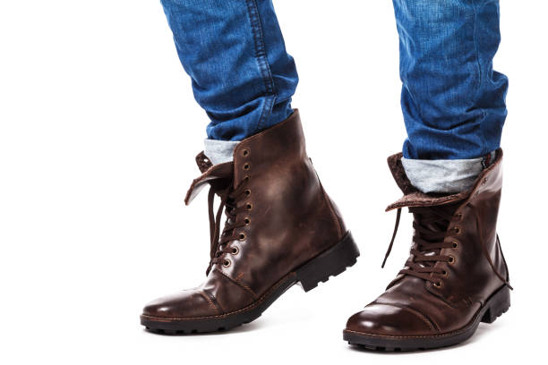 istock Male legs in jeans and leather boots 1179047171