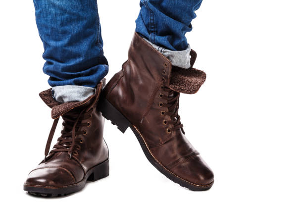 istock Male legs in jeans and leather boots 1179047189