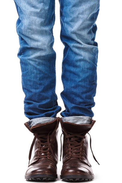 istock Male legs in jeans and leather boots 1179047197