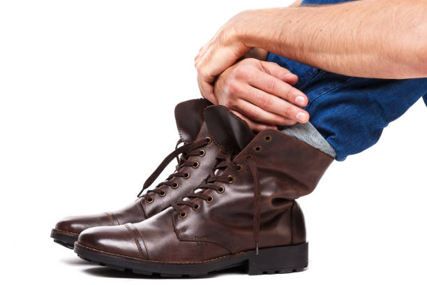 istock Male legs in jeans and leather boots 1179047723