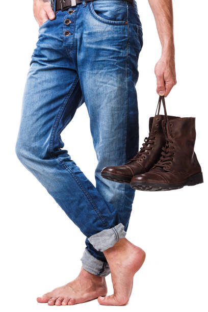 istock Male legs and leather boots 1179047796