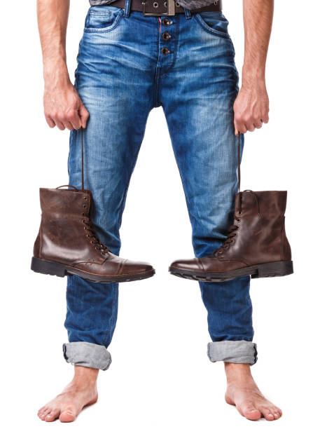 istock Male legs and leather boots 1179047828