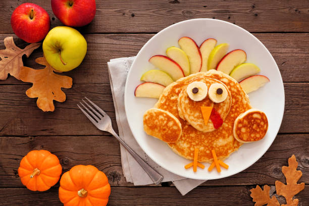 istock Thanksgiving turkey pancake breakfast, top view table scene against rustic wood 1179048243