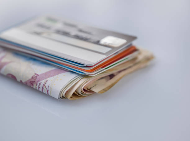istock Stack of credit cards and money 1179050287