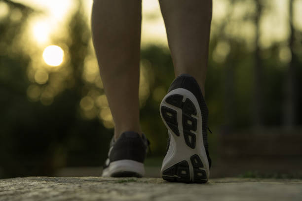 istock Stepping moment while walking on the running track at sunset 1179050361