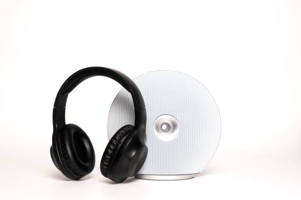 istock Portable bluetooth speaker and earphones on white 1179051045