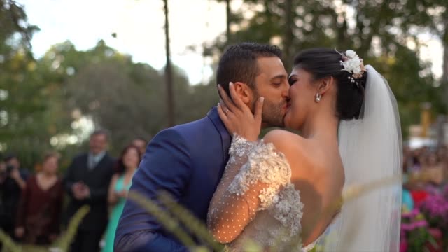 Bride and groom kissing in the altar