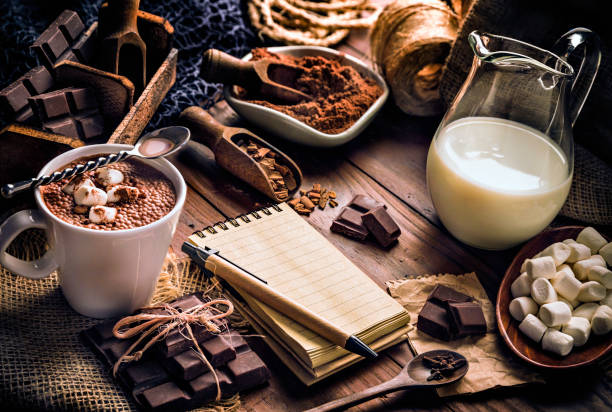 istock Christmas table setup with homemade chocolate mug, marshmallows and note pad 1179053226