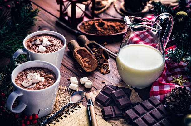 istock Christmas table setup with homemade chocolate mug, marshmallows and note pad 1179053256