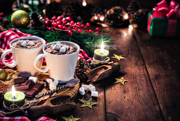 istock Christmas table setup with homemade chocolate mug, marshmallows on rustic table 1179053283