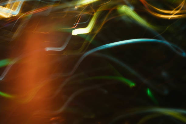 istock neon multicolor glowing curvy lines blur lights 1179064430