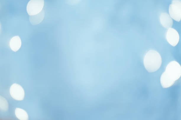 istock blur white lights festive gleam blue background 1179064452