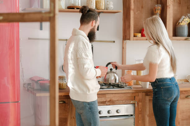 istock family morning routine couple tea modern kitchen 1179064457