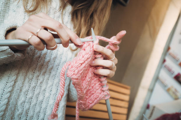 istock Close up on woman's hands knitting 1179065025